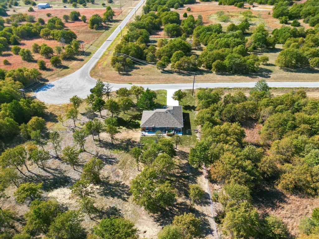 138 Gobbler Road Nocona, TX 76255 - Photo 34 of 35 a view of a garden with a tree
