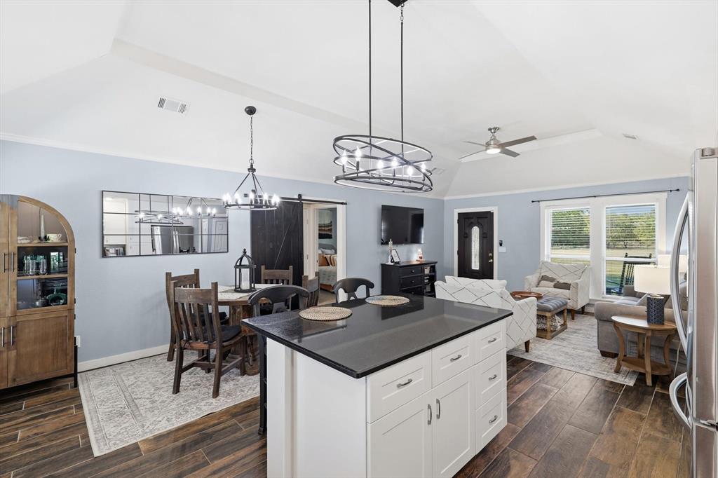 138 Gobbler Road Nocona, TX 76255 - Photo 4 of 35 a view of a dining room with furniture window and wooden floor