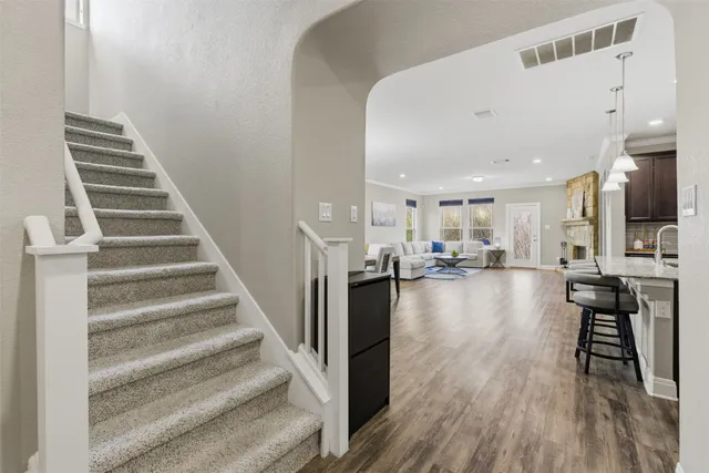a view of a living room and a livingroom with furniture wooden floor