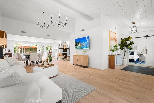 a view of a living room and kitchen