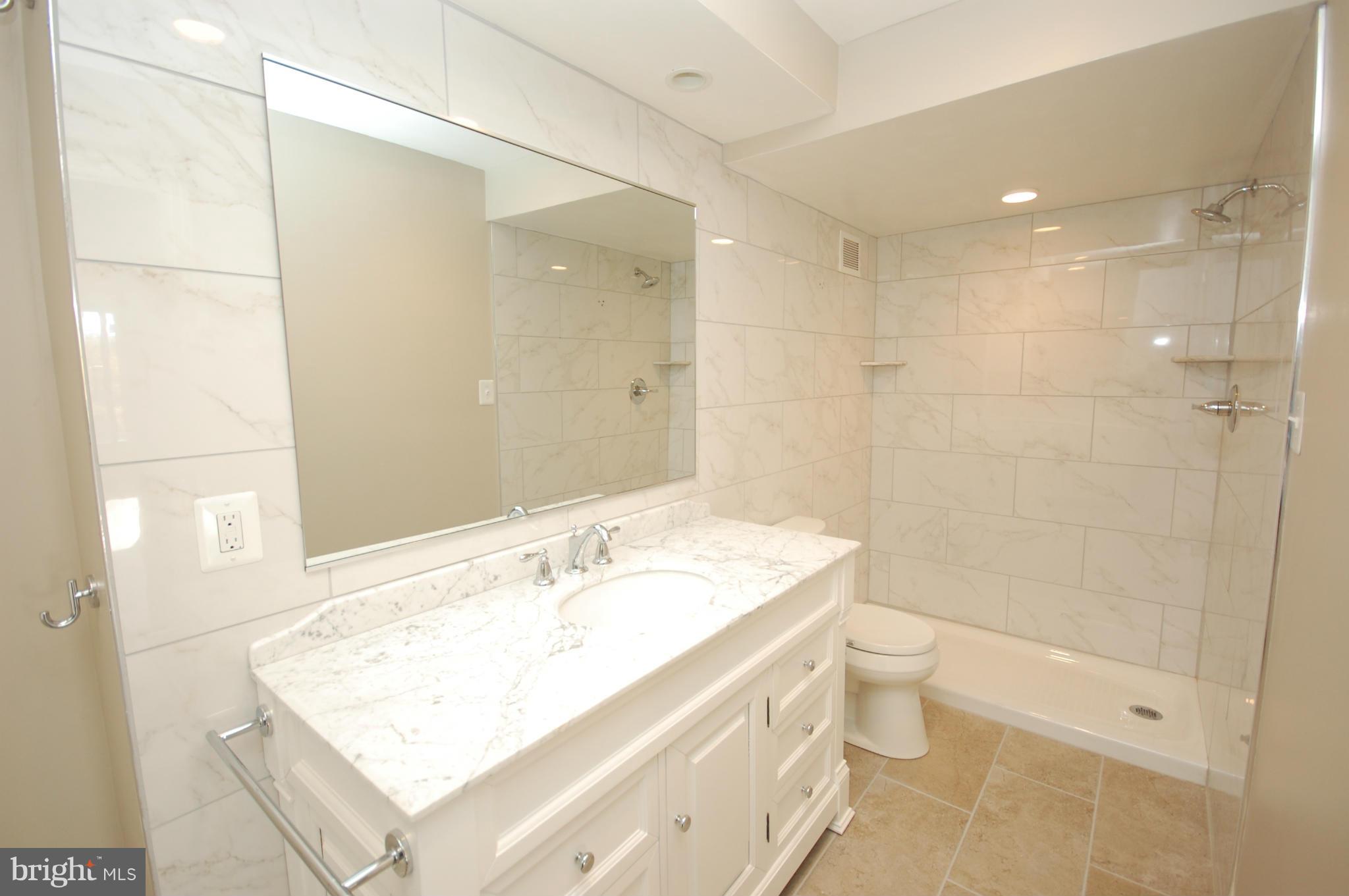 5225 Pooks Hill Road, Unit 809N Bethesda, MD 20814 - Photo 8 of 22 Expanded bath with new vanity, fixtures and floors
