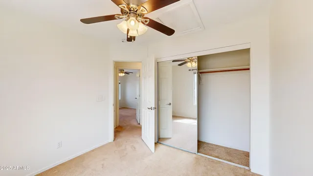 an empty room and a bathroom