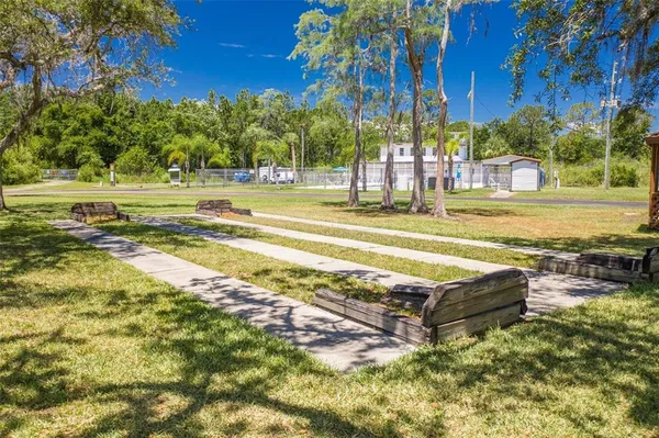 a view of a swimming pool with an outdoor space and seating area