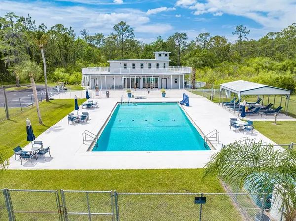 a view of a swimming pool with a patio