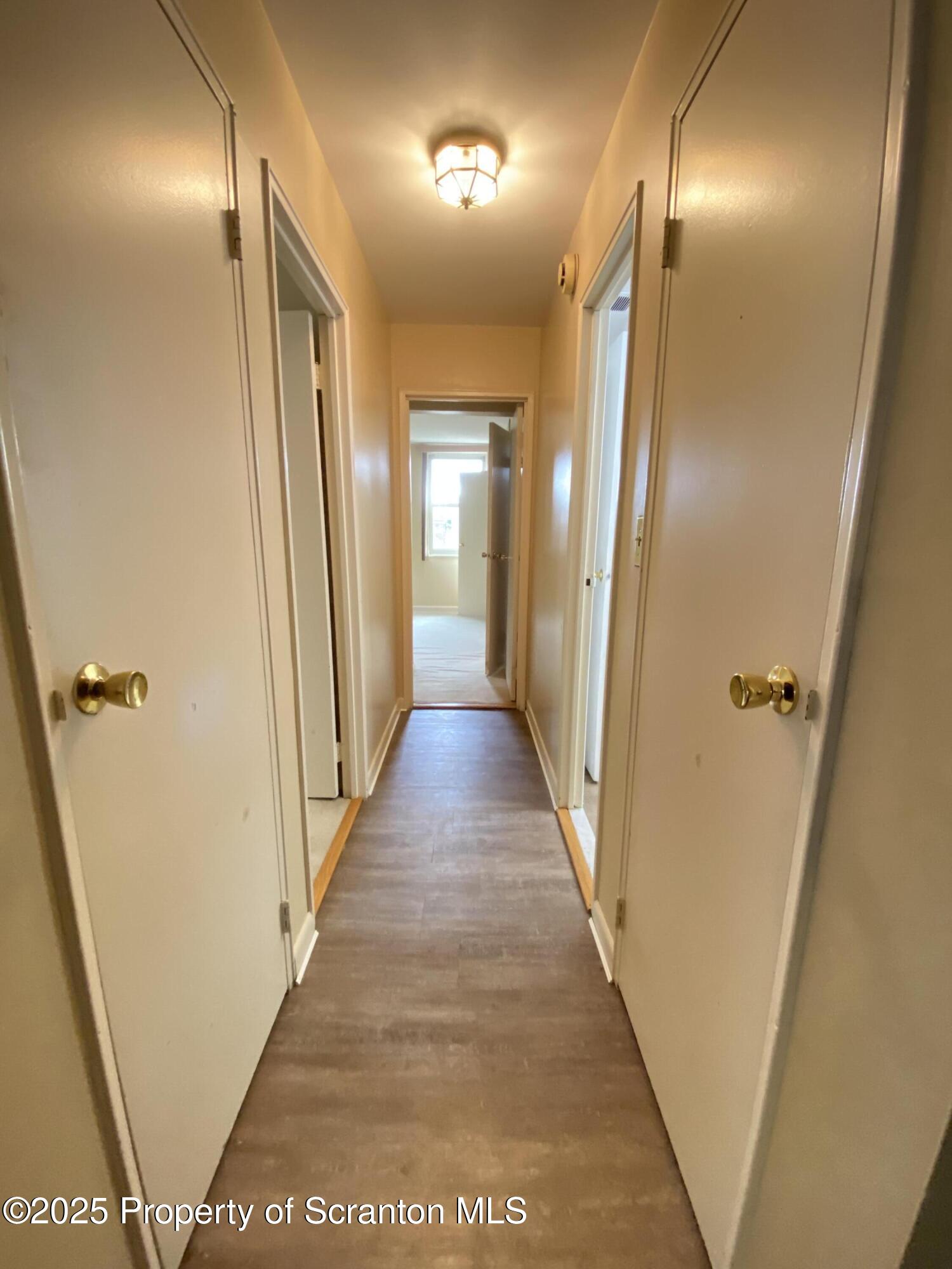 1309 Summit Pointe Scranton, PA 18508 - Photo 14 of 33 a view of a hallway with wooden floor