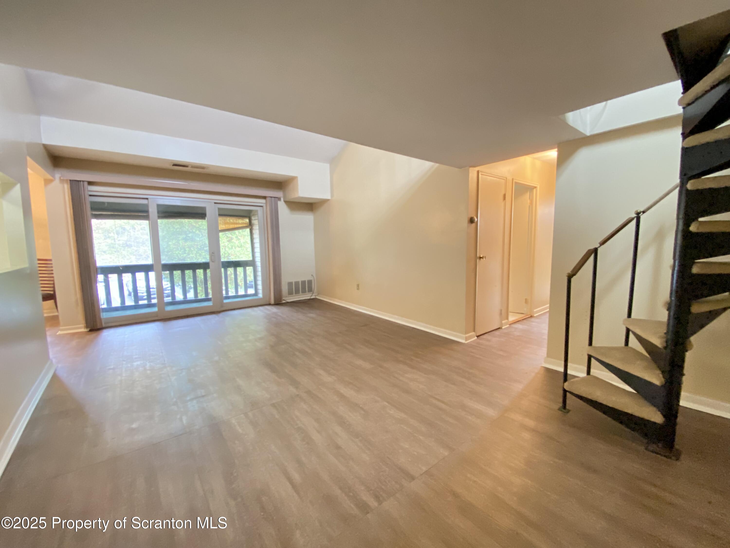1309 Summit Pointe Scranton, PA 18508 - Photo 31 of 33 a view of an empty room with window and stairs