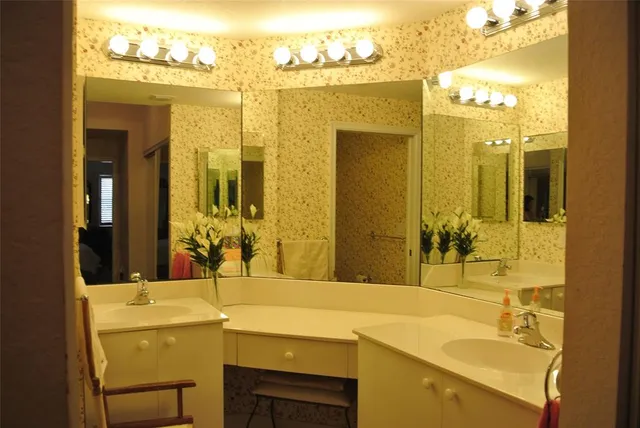 a bathroom with a sink and a mirror