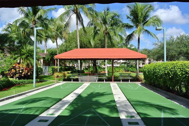 a view of backyard with a garden and outdoor seating
