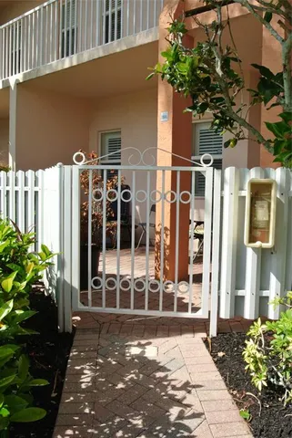 a view of a house with a small yard and plants