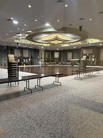 a view of a room with lots of wooden furniture