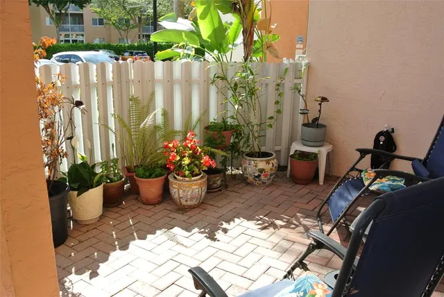 a view of a backyard with sitting area