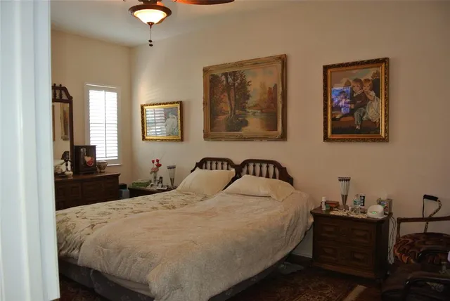 a bedroom with a bed and a table