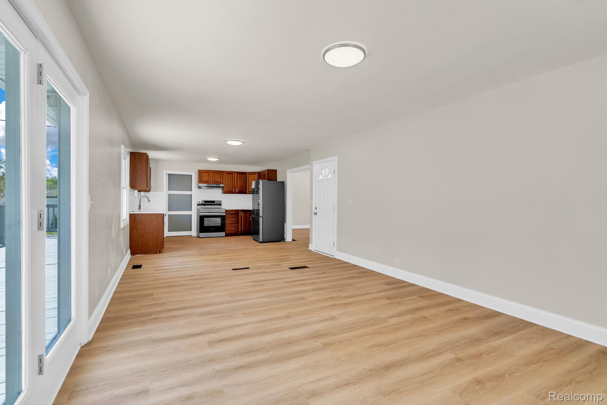 4046 State Road Fort Gratiot, MI 48059 - Photo 18 of 38 Open-concept living space featuring wood-finish flooring, recessed lighting, and a neutral wall palette