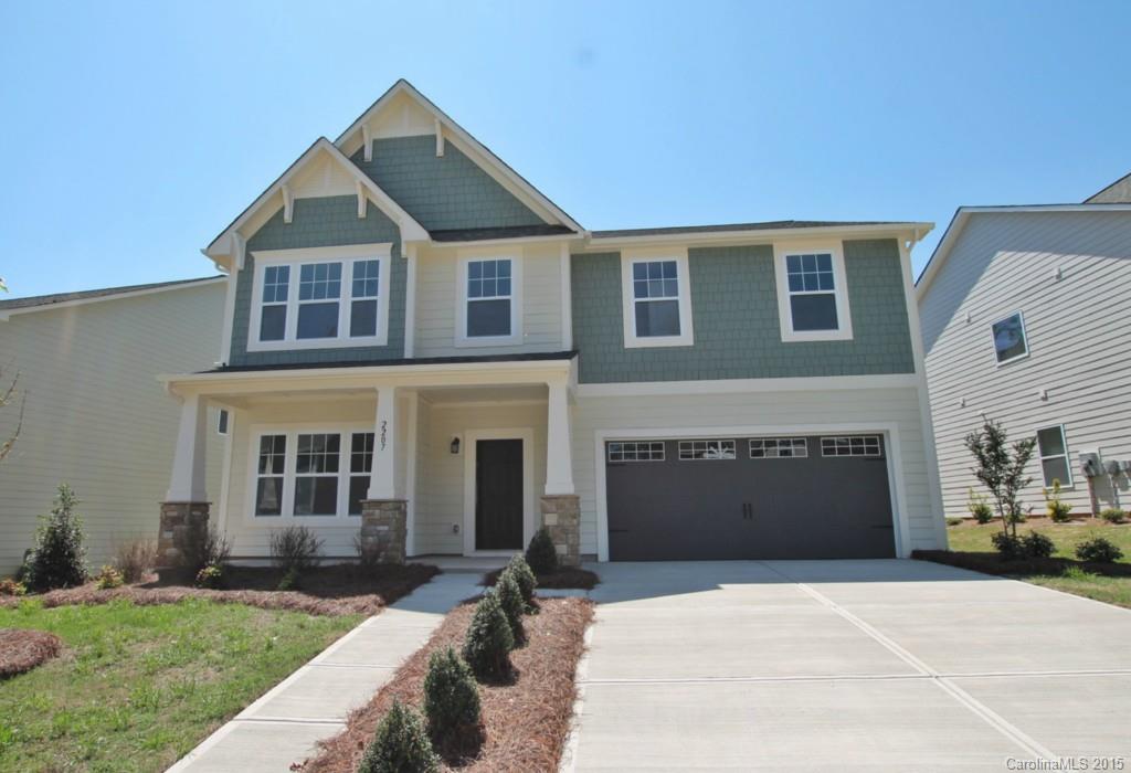 2207 Bluebell Way, Unit 14 Fort Mill, SC 29708 - Photo 1 of 20 a front view of a house with a yard and garage