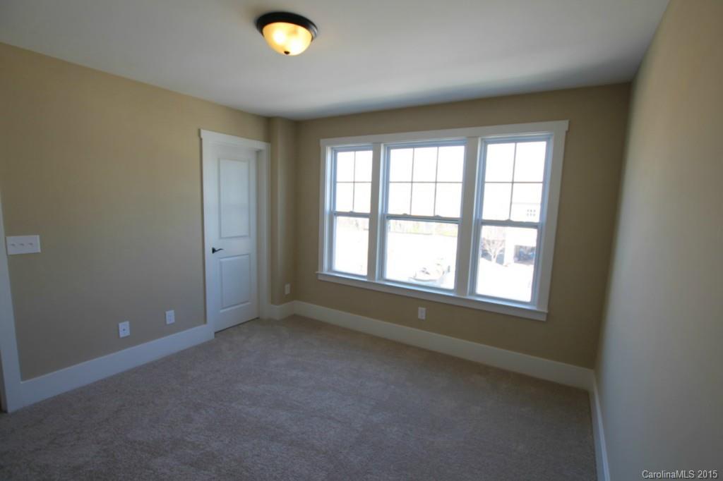2207 Bluebell Way, Unit 14 Fort Mill, SC 29708 - Photo 13 of 20 an empty room with a empty space and windows