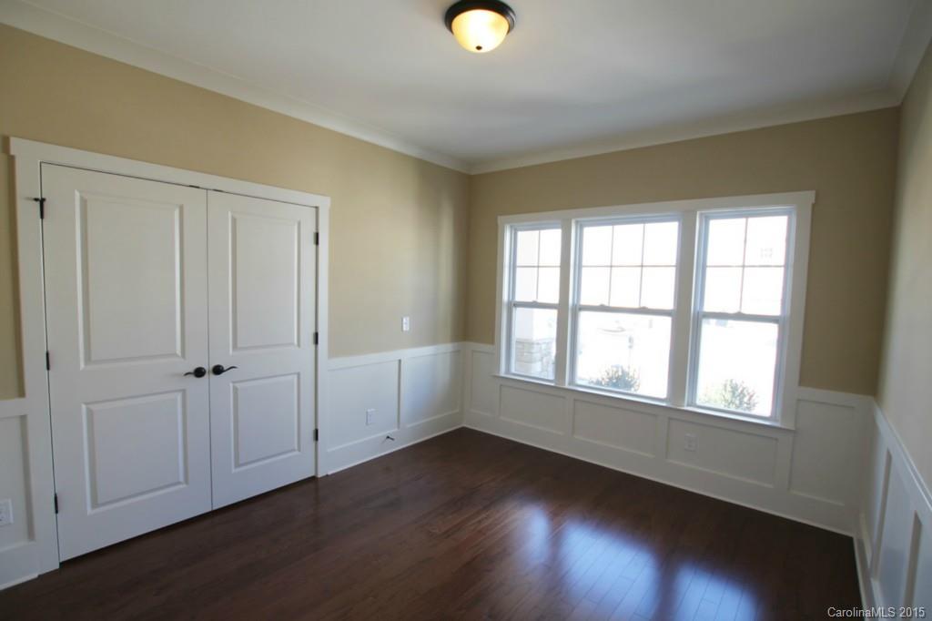 2207 Bluebell Way, Unit 14 Fort Mill, SC 29708 - Photo 3 of 20 an empty room with wooden floor and windows