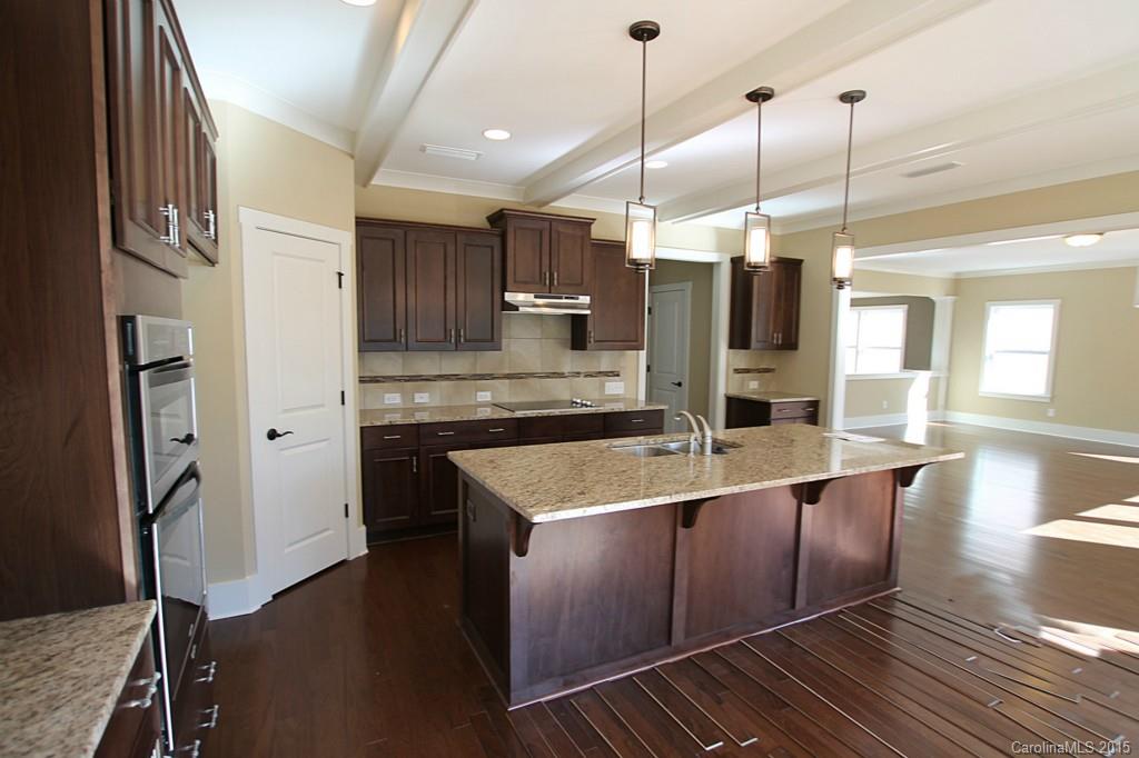 2207 Bluebell Way, Unit 14 Fort Mill, SC 29708 - Photo 7 of 20 a kitchen with stainless steel appliances granite countertop a sink a oven and a refrigerator