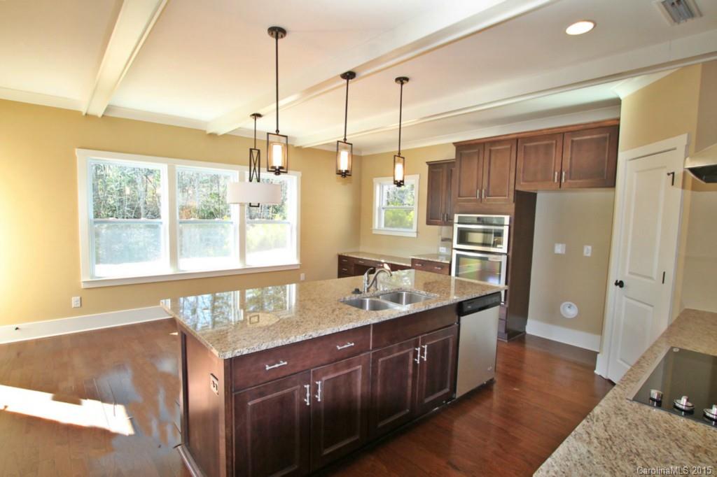 2207 Bluebell Way, Unit 14 Fort Mill, SC 29708 - Photo 8 of 20 a kitchen with a sink stove and refrigerator