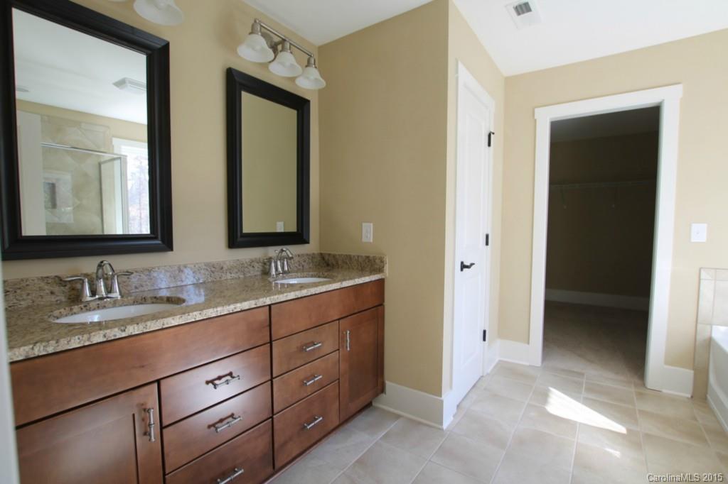 2207 Bluebell Way, Unit 14 Fort Mill, SC 29708 - Photo 10 of 20 a bathroom with double vanity sinks and a mirror