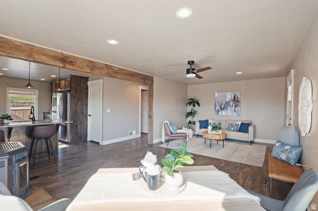 115 East 1600th Street North Santaquin, UT 84655 - Photo 5 of 52 Open concept living space featuring wood-finish flooring, recessed lighting, and a dark wood ceiling fan