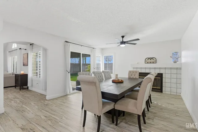a view of a dining room with furniture and wooden floor