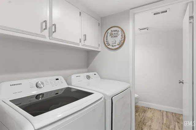 a view of storage and utility room with washer and dryer