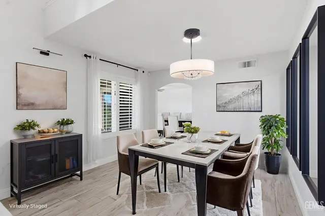 a view of a dining room with furniture window and wooden floor