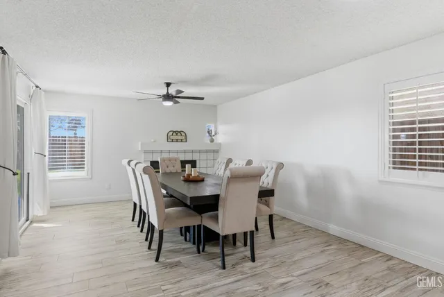 a view of a dining room with furniture and window
