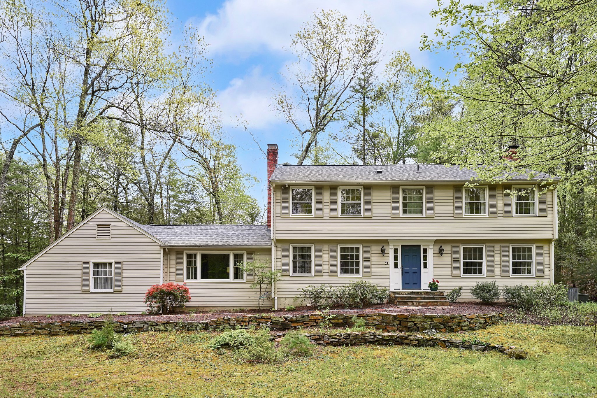 Classic New England Colonial nestled in desirable Beldenwood Forest neighborhood