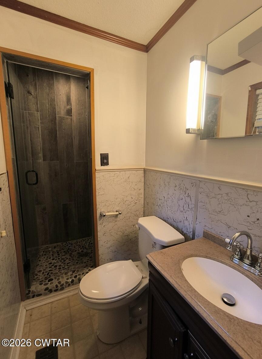 513 Viar Road Dyersburg, TN 38024 - Photo 27 of 37 a bathroom with a sink a toilet and shower
