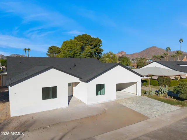 a house with trees in the background