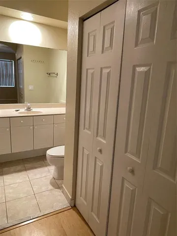 a bathroom with a sink a toilet and a shower