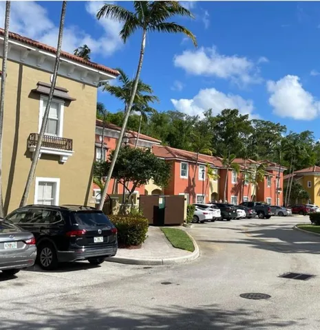 a view of a street that has a street sign on the side of it