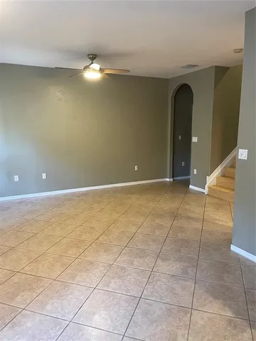 a view of an empty room with windows