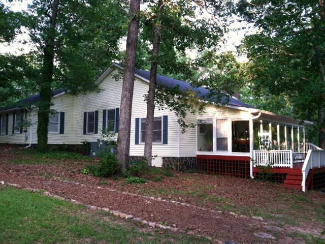 50 McCard Road Thomaston, GA 30286 - Photo 1 of 1 a view of a house with backyard and sitting area