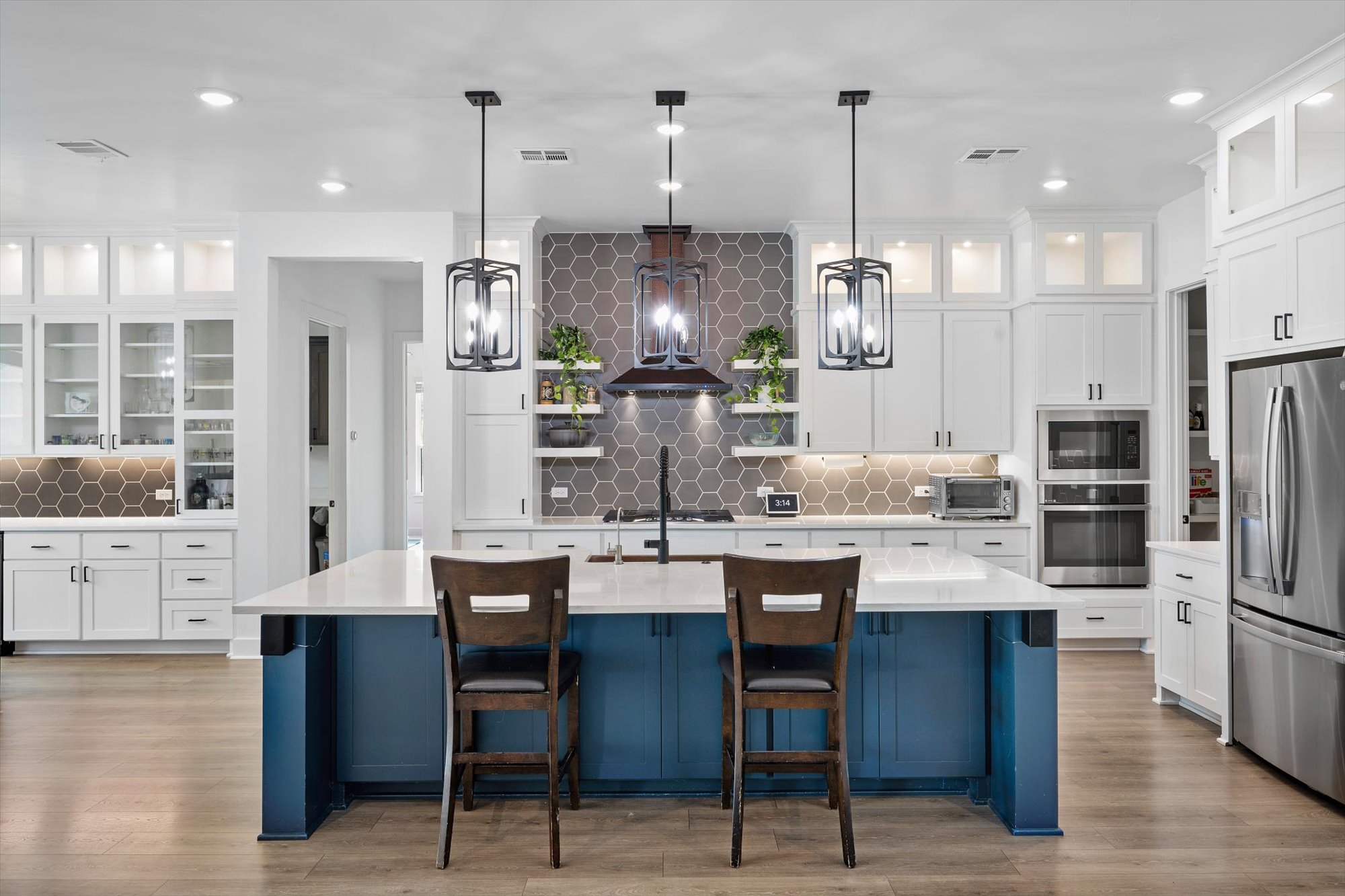 638 Strada Luca Florence, TX 76527 - Photo 9 of 38 Culinary excellence awaits in this well-appointed kitchen, showcasing a central island and a full suite of appliances.