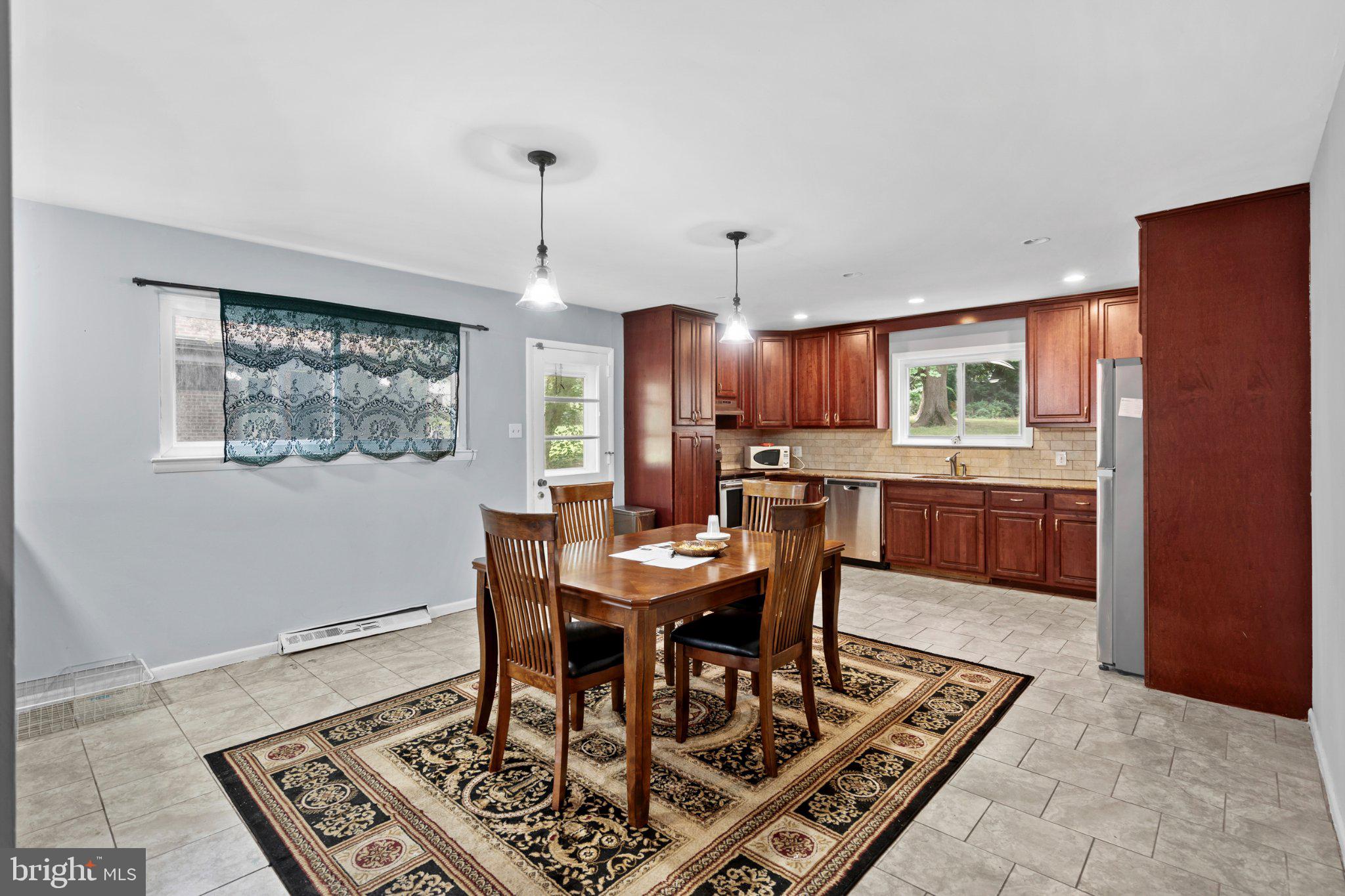 609 Foster Road Cheltenham, PA 19012 - Photo 13 of 44 Inviting kitchen with warm wood tones.