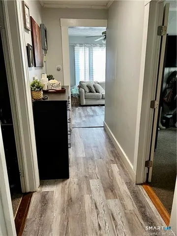 a room with wooden floor and furniture