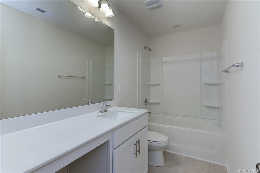 2014 Blue Pond Road Matthews, NC 28104 - Photo 21 of 32 a bathroom with a sink a toilet and shower