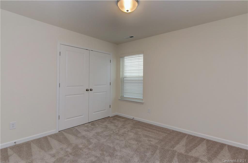 2014 Blue Pond Road Matthews, NC 28104 - Photo 23 of 32 a view of an empty room with window and closet area