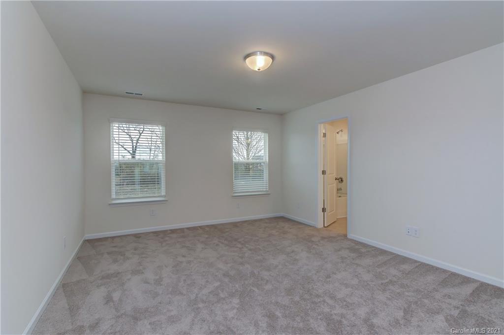 2014 Blue Pond Road Matthews, NC 28104 - Photo 24 of 32 an empty room with windows and closet