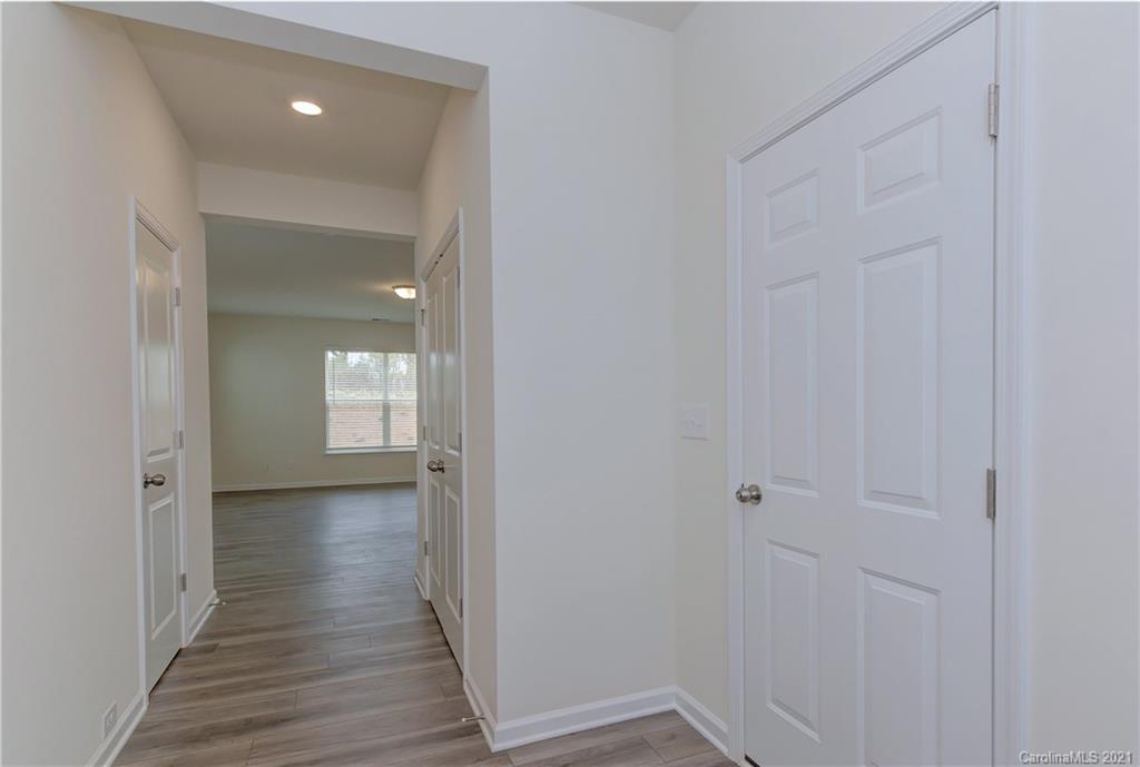2014 Blue Pond Road Matthews, NC 28104 - Photo 4 of 32 a view of a hallway with wooden floor