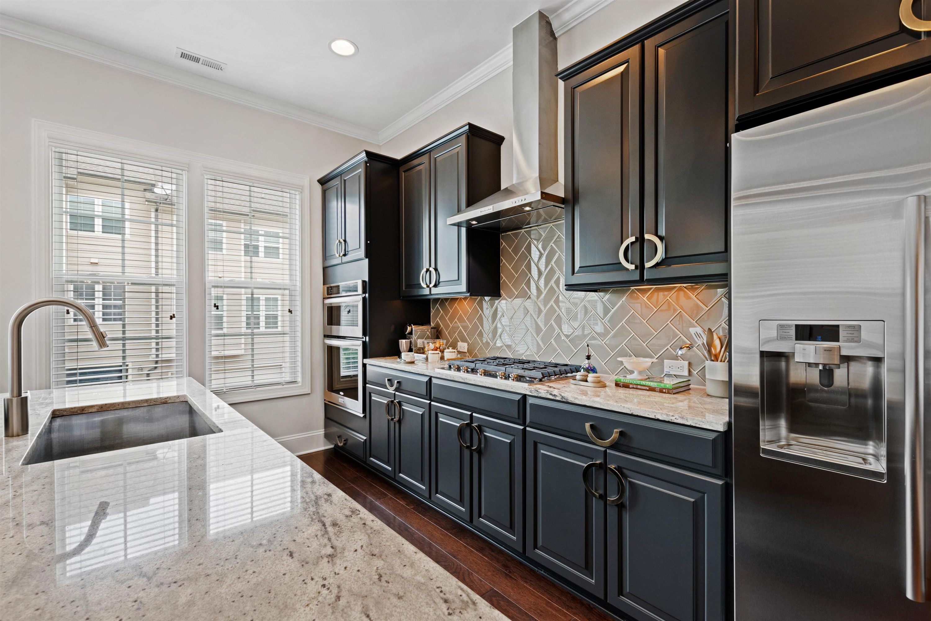 220 Penley Circle Raleigh, NC 27609 - Photo 14 of 56 a kitchen with stainless steel appliances granite countertop a sink stove and refrigerator