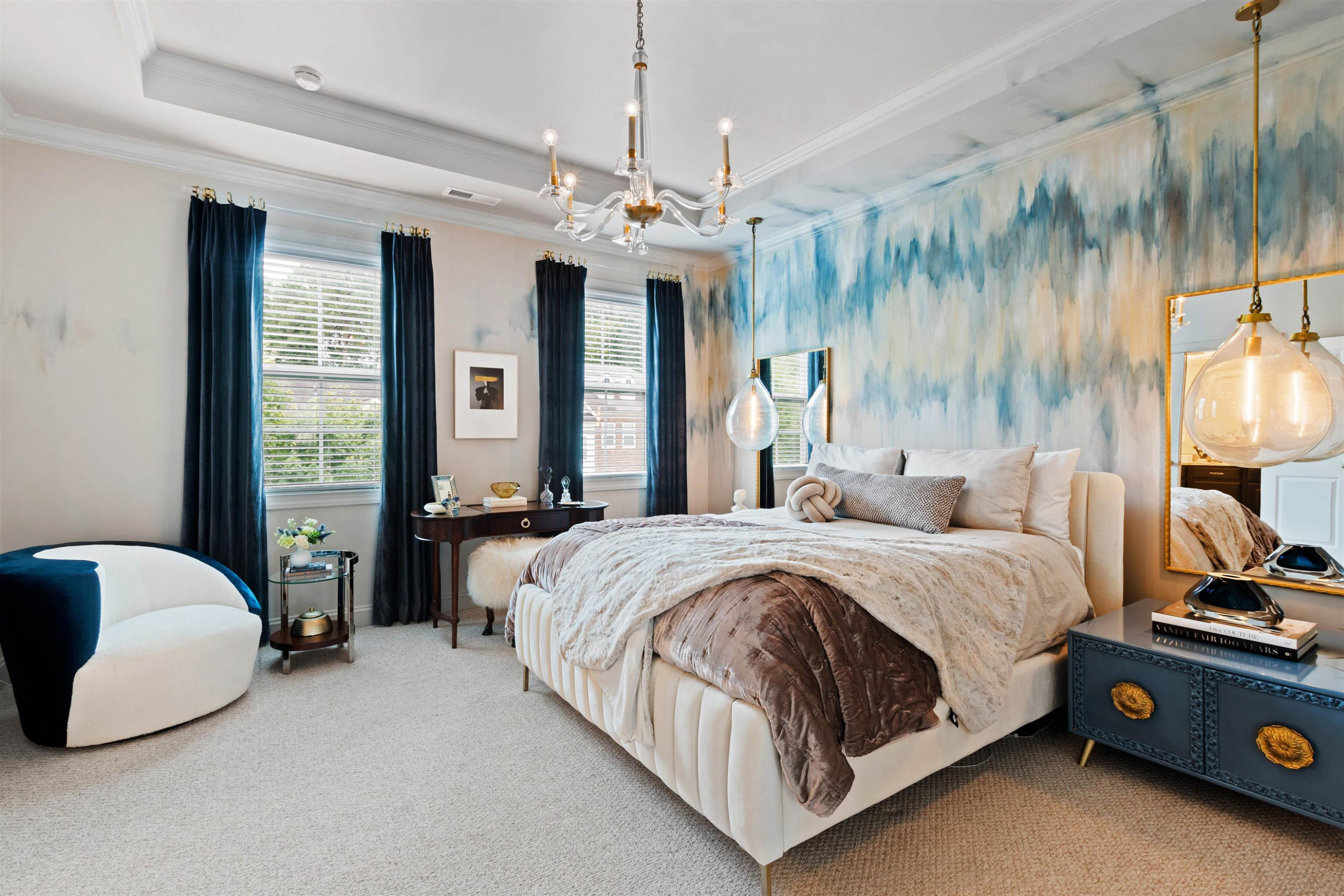220 Penley Circle Raleigh, NC 27609 - Photo 29 of 56 a spacious bedroom with a bed chandelier and window