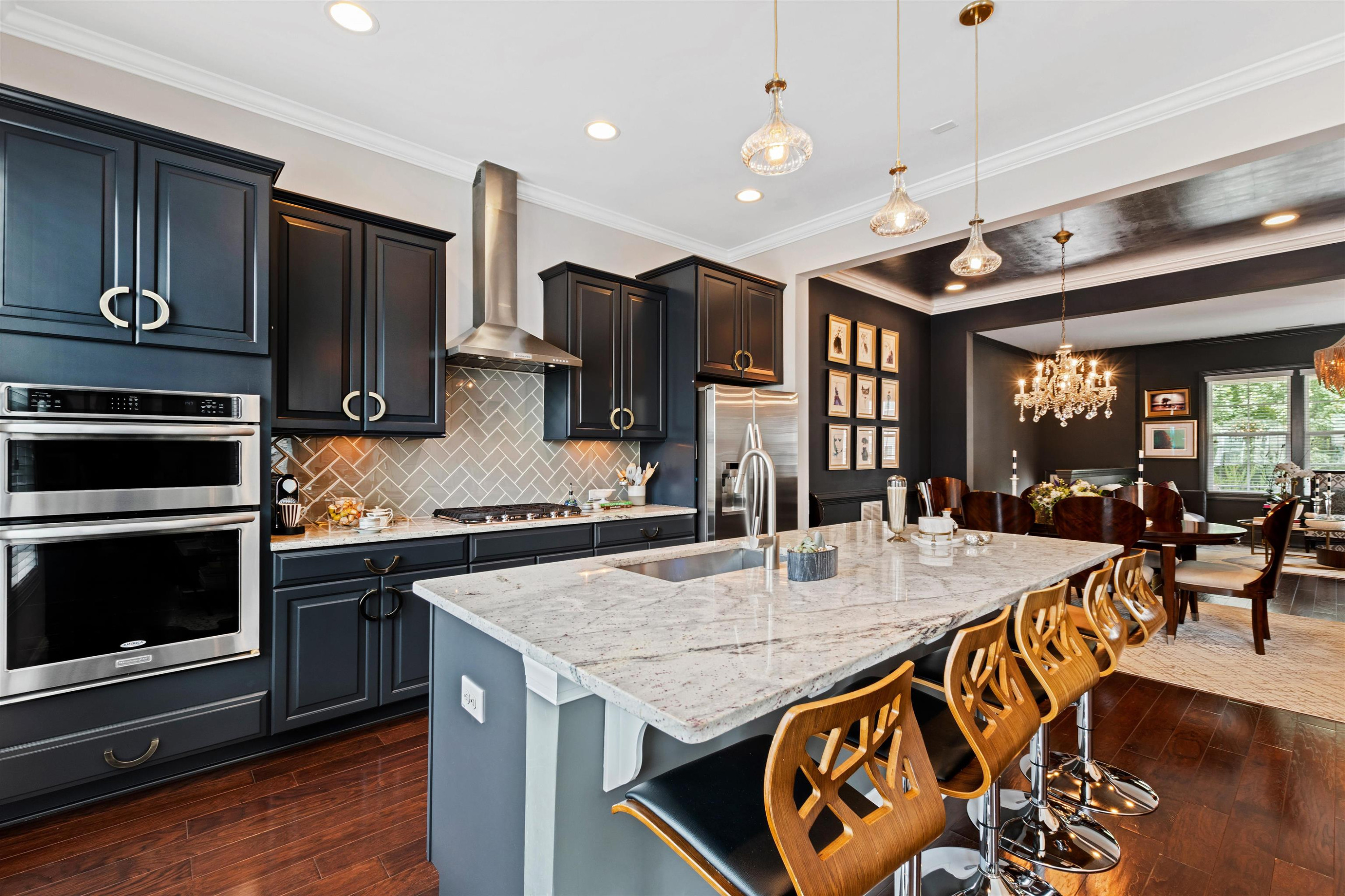220 Penley Circle Raleigh, NC 27609 - Photo 3 of 56 a kitchen with stainless steel appliances granite countertop a stove and refrigerator