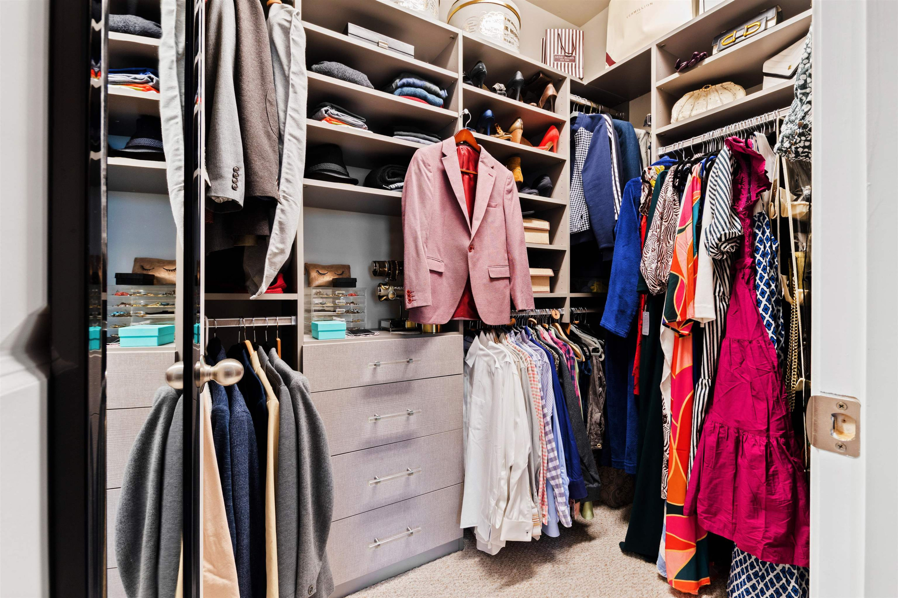 220 Penley Circle Raleigh, NC 27609 - Photo 33 of 56 a view of walk in closet with clothes and shoes