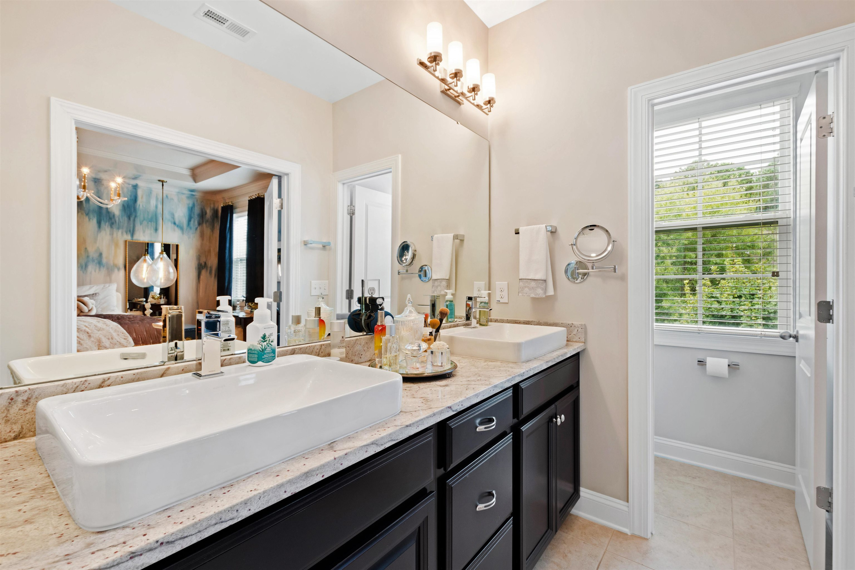 220 Penley Circle Raleigh, NC 27609 - Photo 36 of 56 a bathroom with a sink double vanity and a mirror