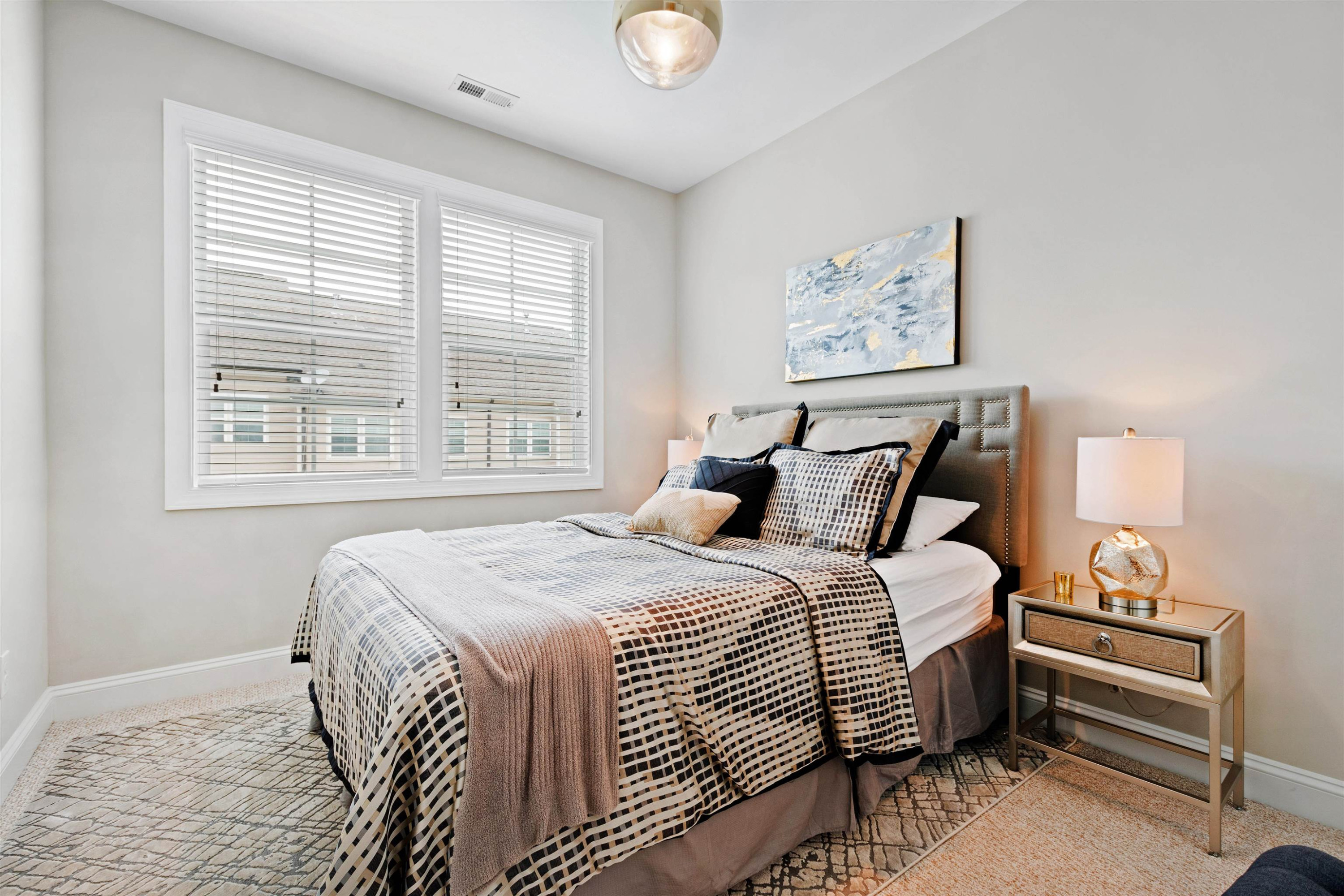 220 Penley Circle Raleigh, NC 27609 - Photo 39 of 56 a bedroom with a bed and a window