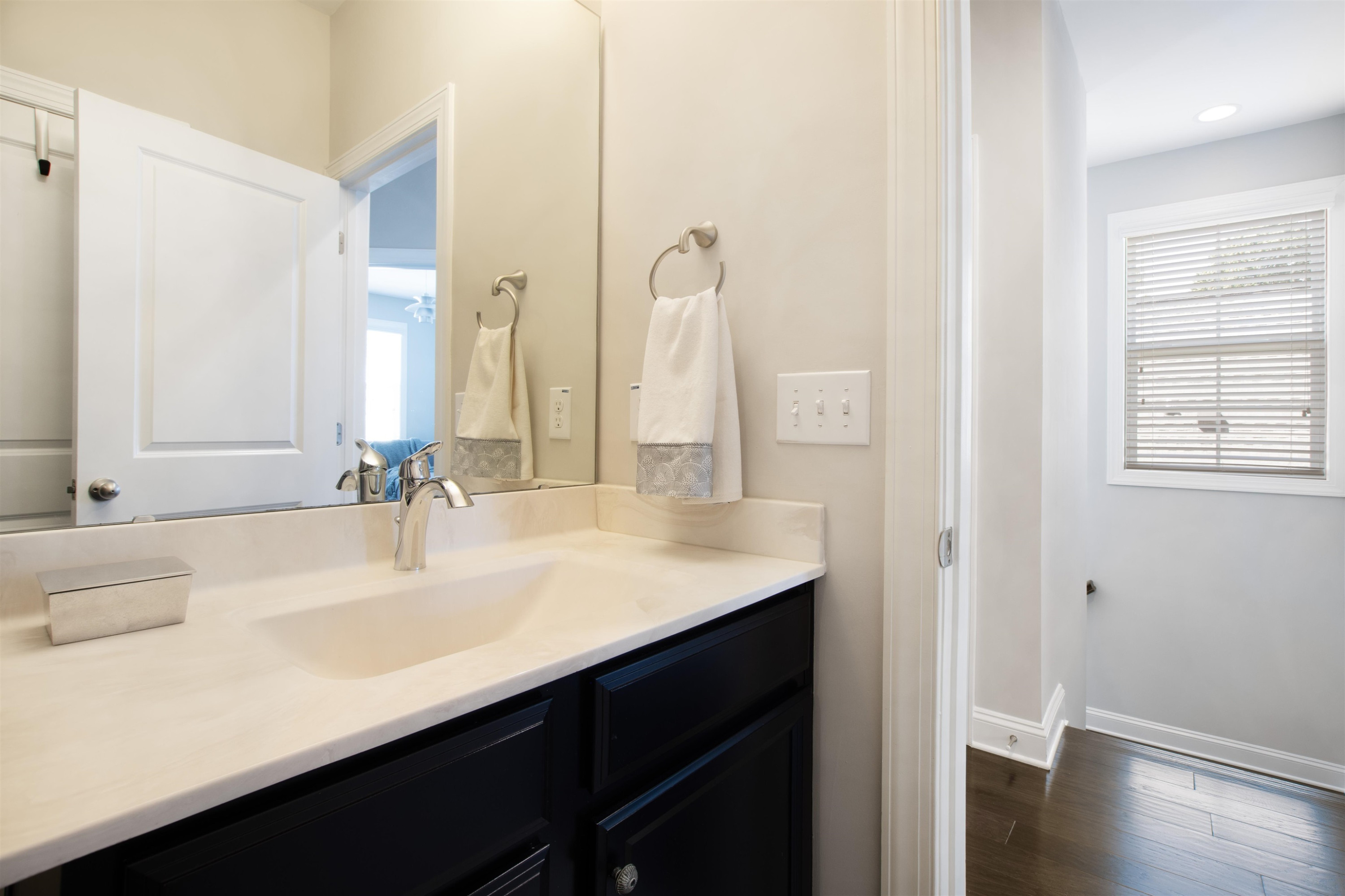 220 Penley Circle Raleigh, NC 27609 - Photo 43 of 56 a bathroom with a sink and a mirror