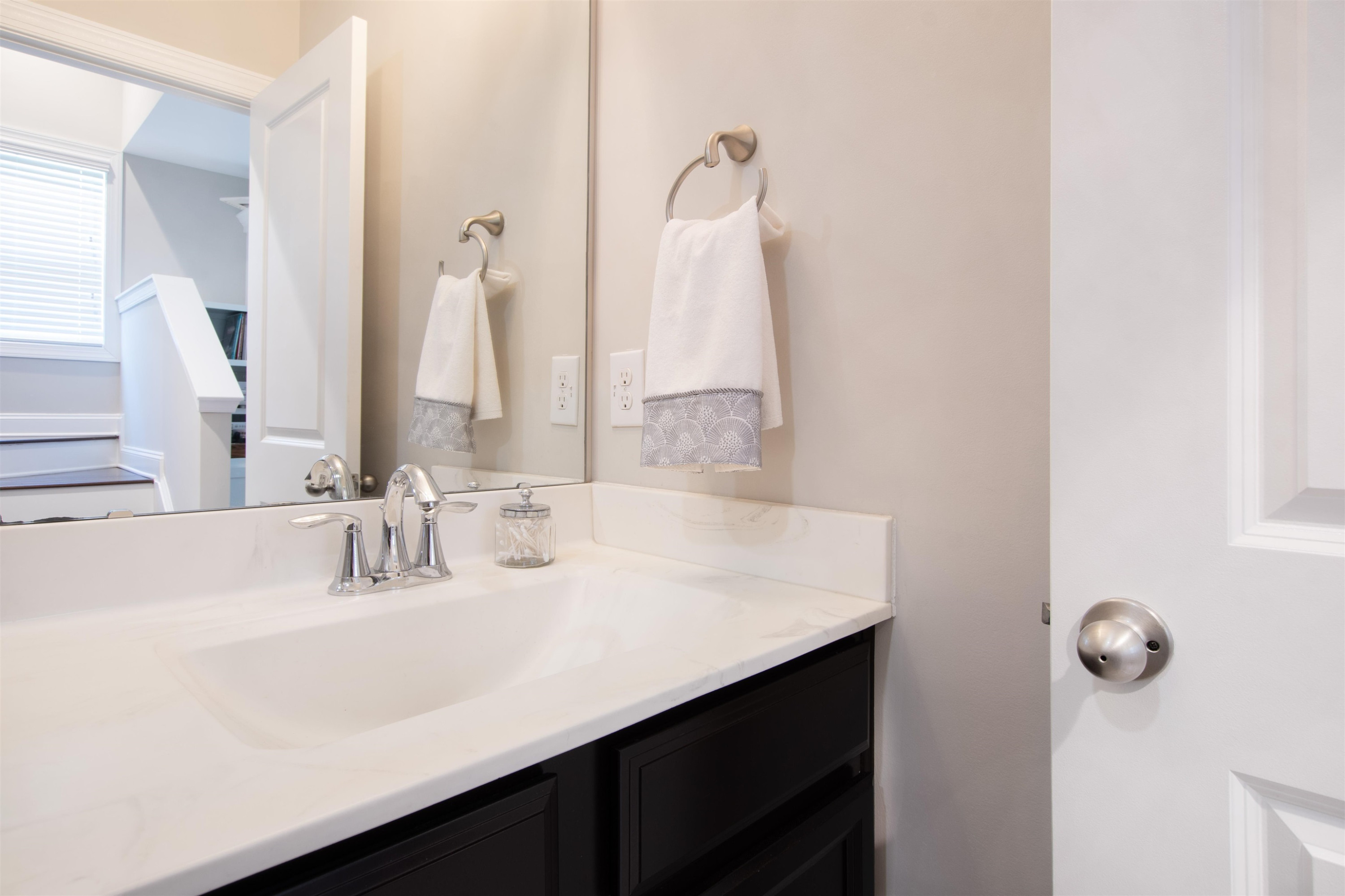 220 Penley Circle Raleigh, NC 27609 - Photo 49 of 56 a bathroom with a sink vanity and a mirror
